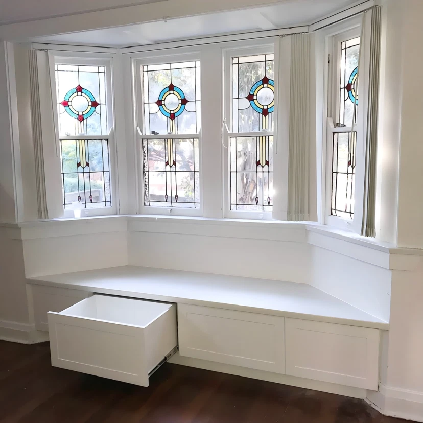 Built-in drawer tower and shelving unit fitted into an alcove