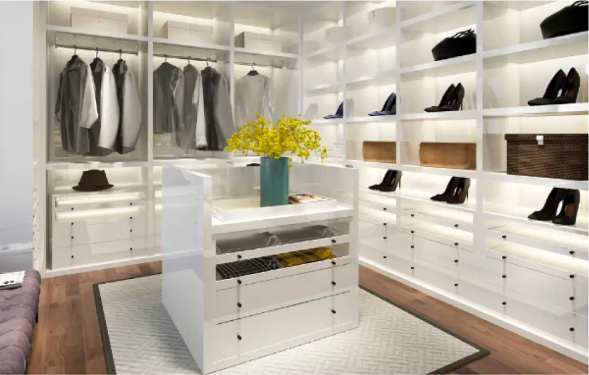 Walk-in wardrobe with central island unit and open shelving